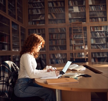Girl studying in a library