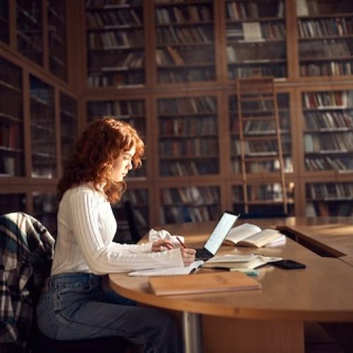 Girl studying in a library
